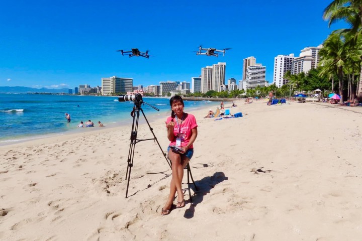 a person standing on a sandy beach